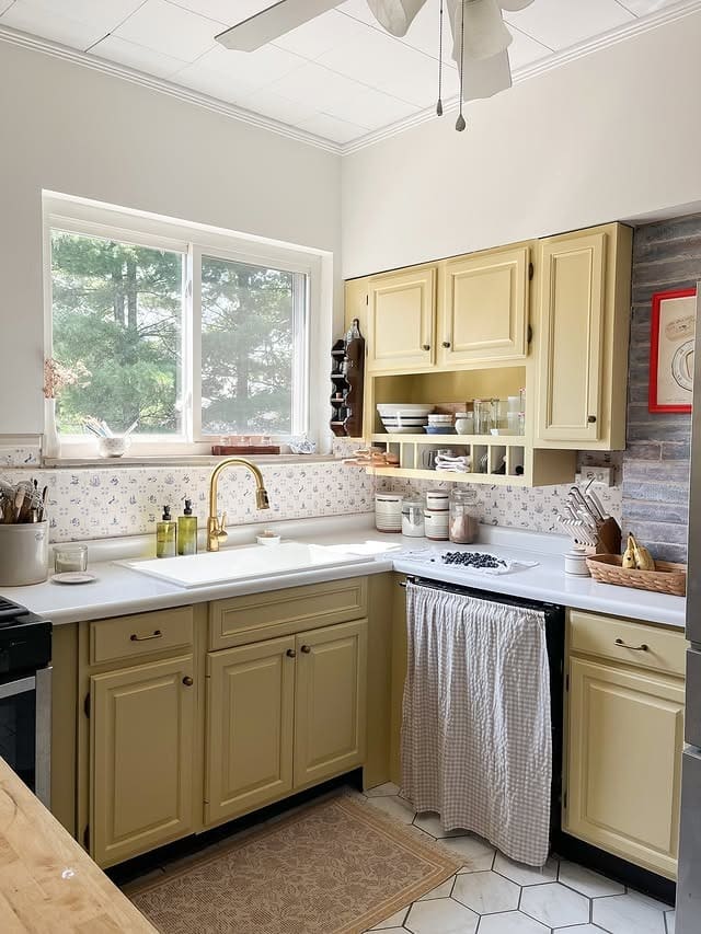 12. Country-Style Yellow Kitchen with Soft Grey Backdrop - yellow and grey kitchen ideas