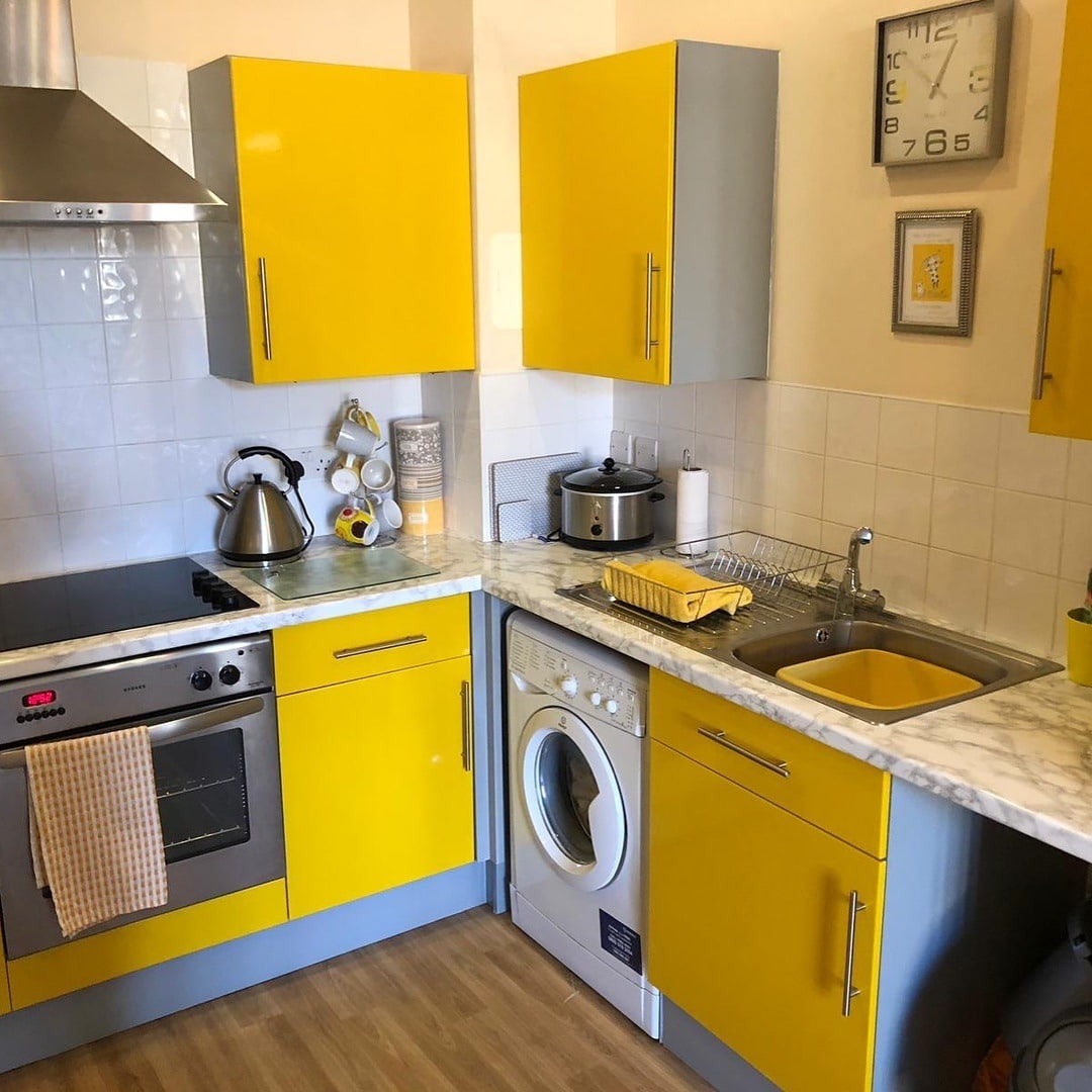 21. Bright Yellow Gloss Cabinets with Soft Grey Base Units - yellow and grey kitchen ideas