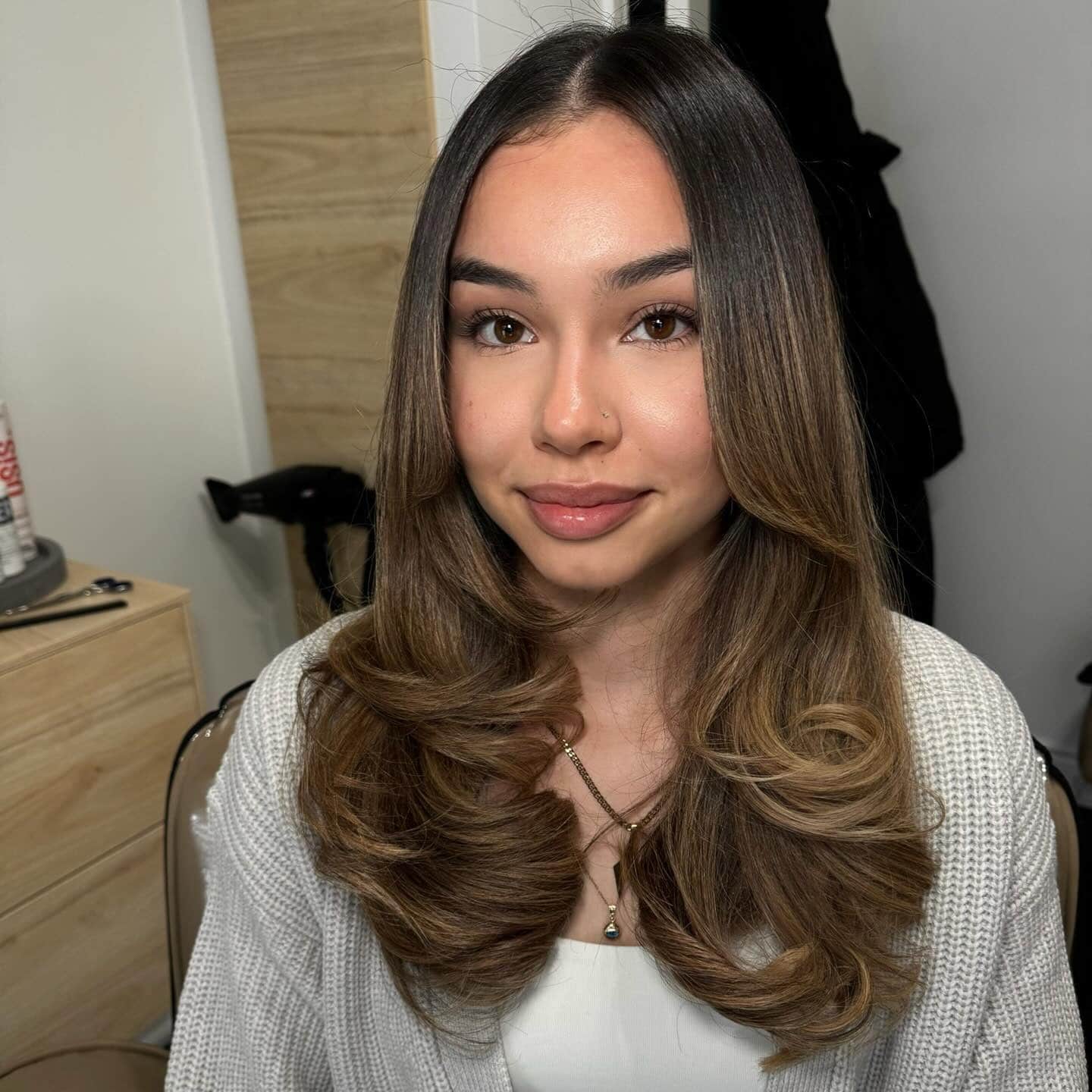 1. Soft Caramel Layers with Center-Part Framing - Face-Framing Haircuts