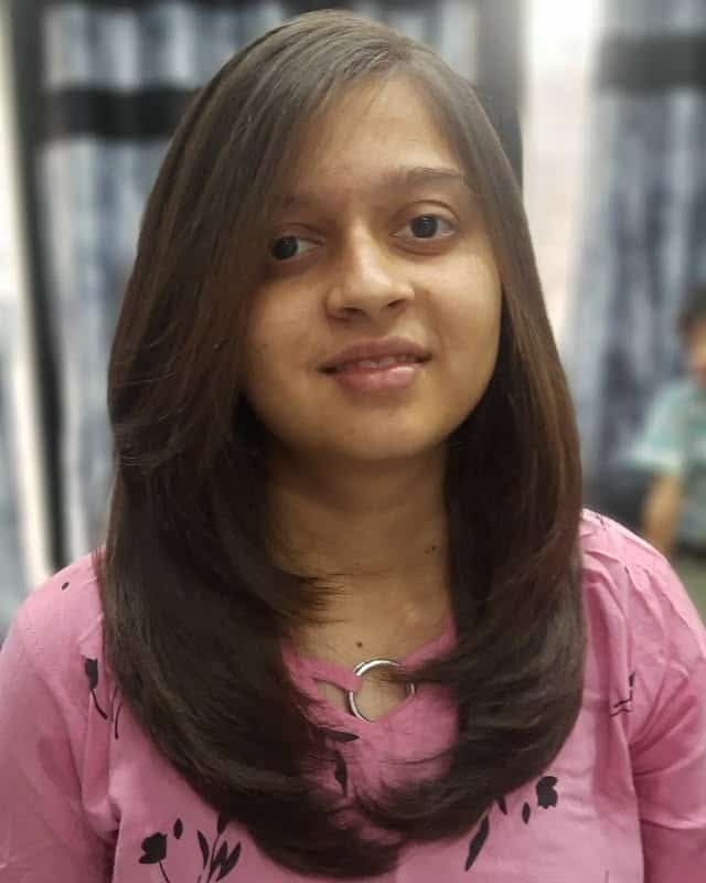 2. Classic Mid-Length Feathered Layers in Warm Brunette - Face-Framing Haircuts