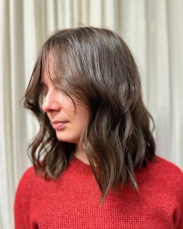 3. Tousled Medium Waves with Subtle Face Contouring - Face-Framing Haircuts
