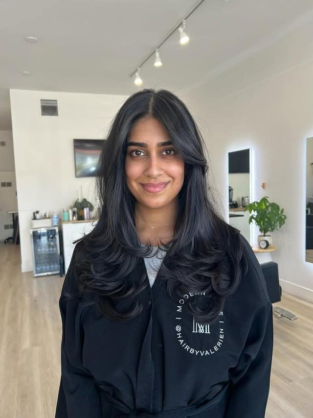 7. Sleek Dark Layers with Balanced Curtain Framing - Face-Framing Haircuts