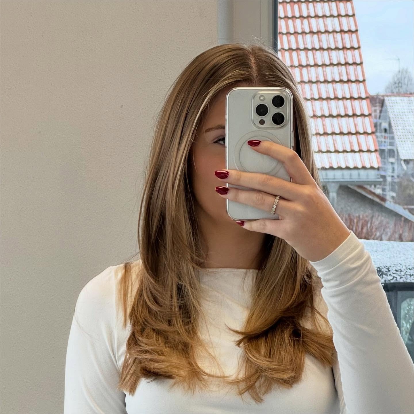 15. Golden Beige Layers with Light, Airy Framing - Face-Framing Haircuts