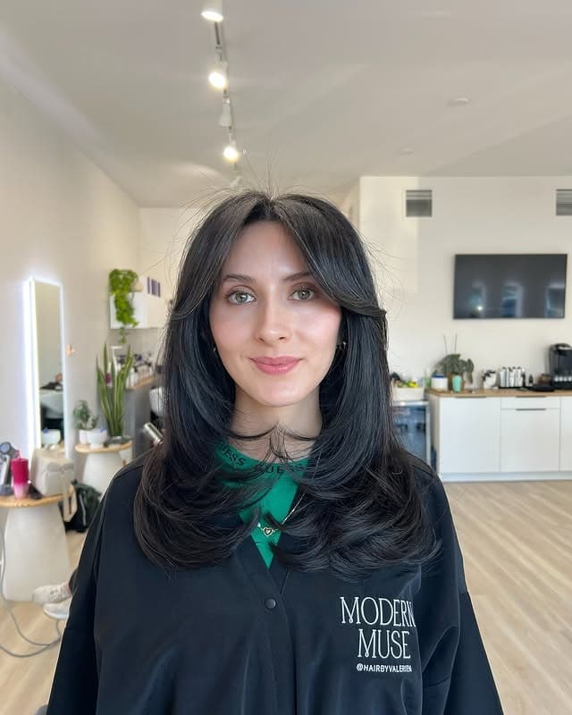 18. Jet-Black Curtain Layer Cut with Smooth Movement - Face-Framing Haircuts