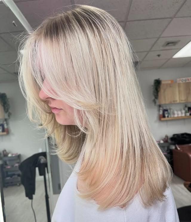 19. Soft Pearl Blonde Layers with Delicate Front Lift - Face-Framing Haircuts