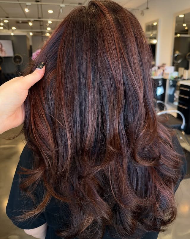 1. Soft Burgundy Ribbon Balayage on Layered Waves - Burgundy Balayage Hair Color