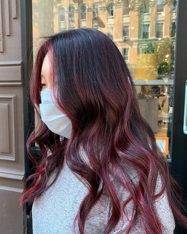 4. Crimson-Tinted Balayage With Defined Curl Flow - Burgundy Balayage Hair Color