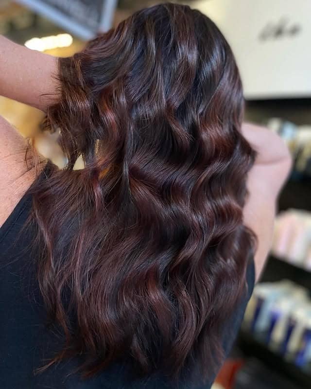 11. Mahogany Burgundy Waves With Soft Reflective Shine - Burgundy Balayage Hair Color