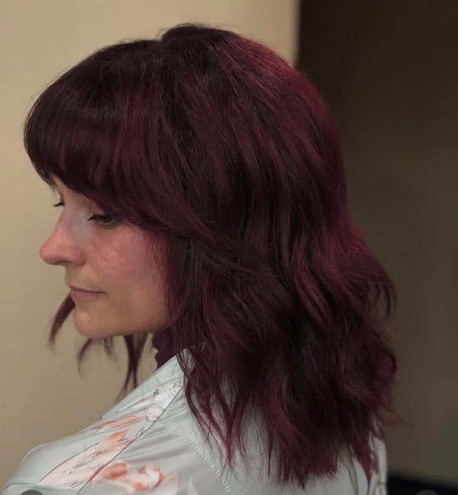 13. Deep Plum Shoulder-Length Cut With Soft Fringe - Burgundy Balayage Hair Color