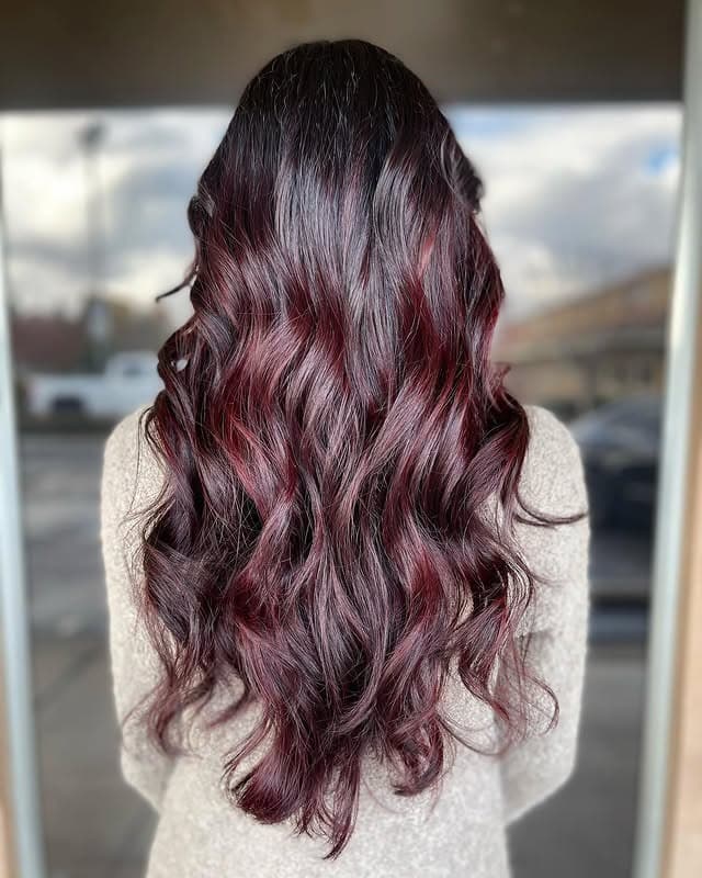 18. Crimson-Laced Burgundy Balayage With Cascading Curls - Burgundy Balayage Hair Color