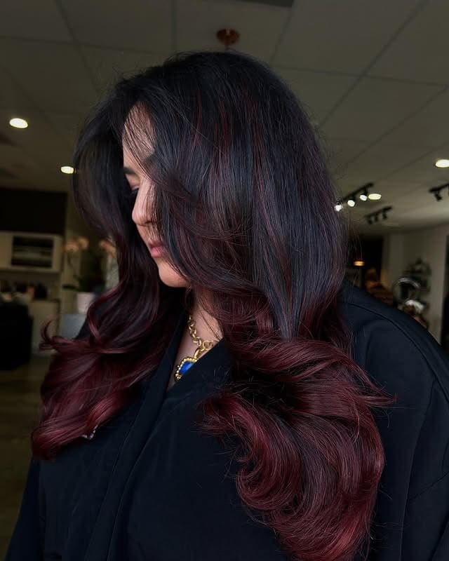 19. Rich Burgundy Layers With Face-Framing Curvature - Burgundy Balayage Hair Color