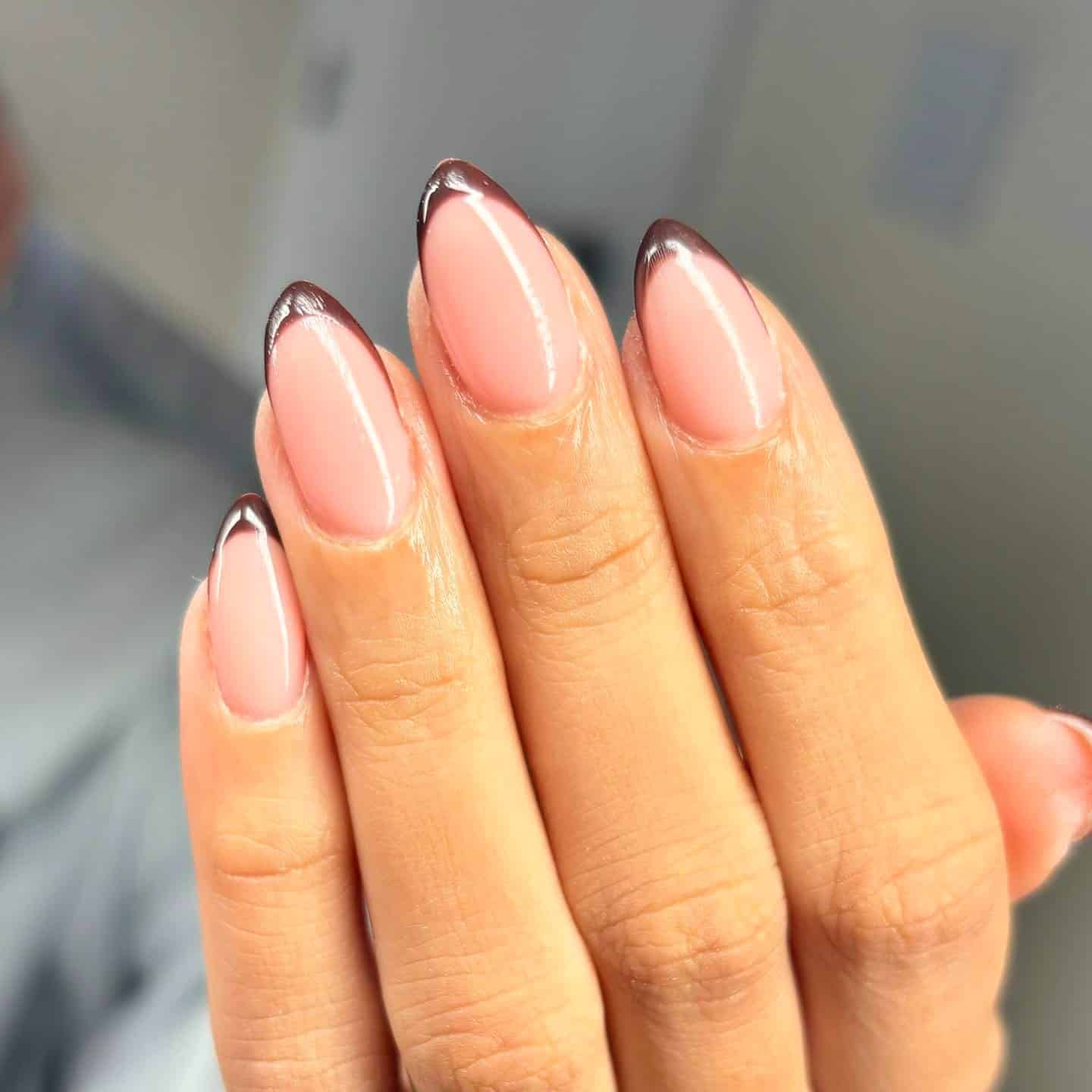 9. Glossy Cocoa Outline French Almond Nails - fall french nail ideas