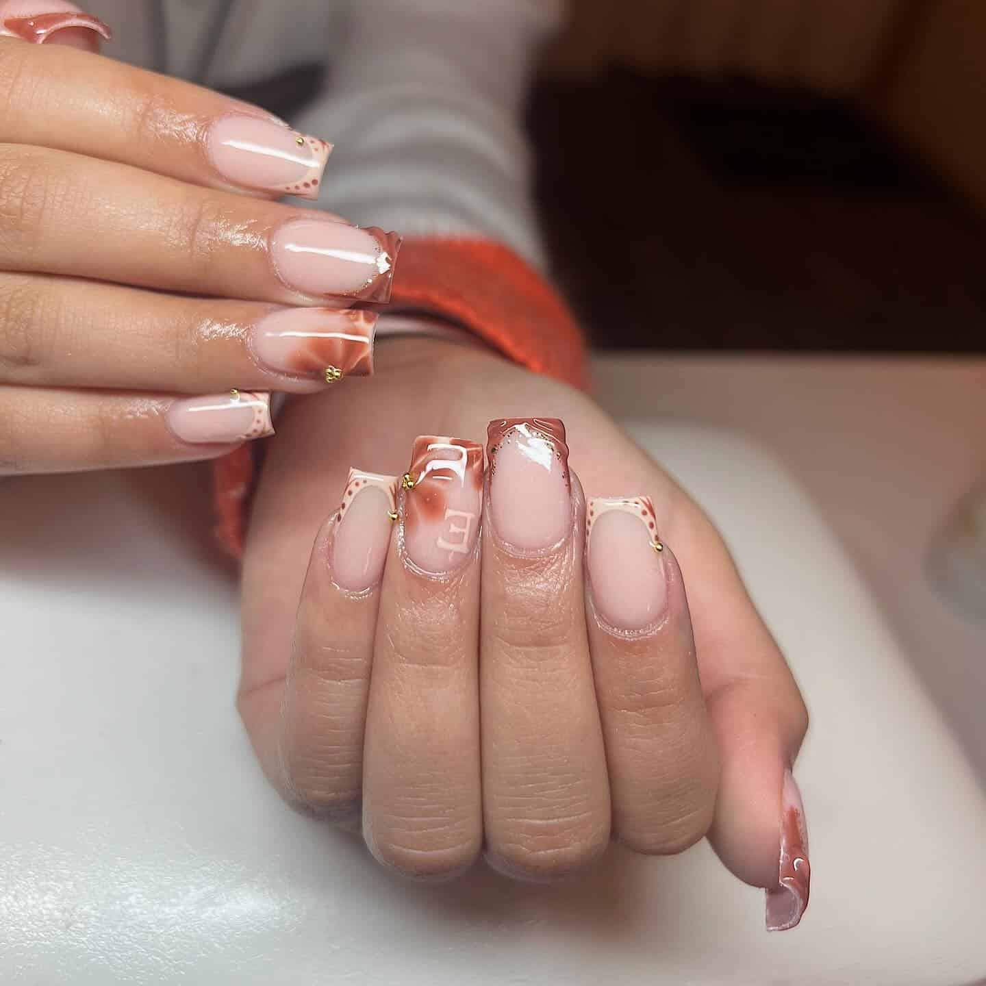 10. Marbled Bronze French Square Nails with Gold Detail - fall french nail ideas