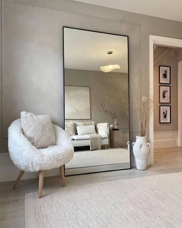 7. Frameless Modern Mirror in Stone-Gray and Cream - mirrors in living room ideas