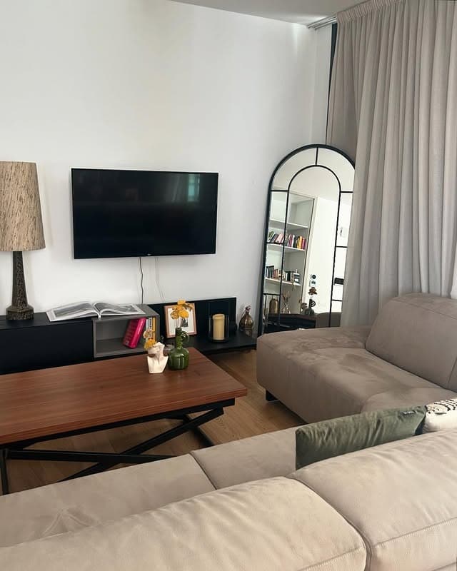 17. Frameless Floor Mirror in Stone Gray and Cream Textures - mirrors in living room ideas