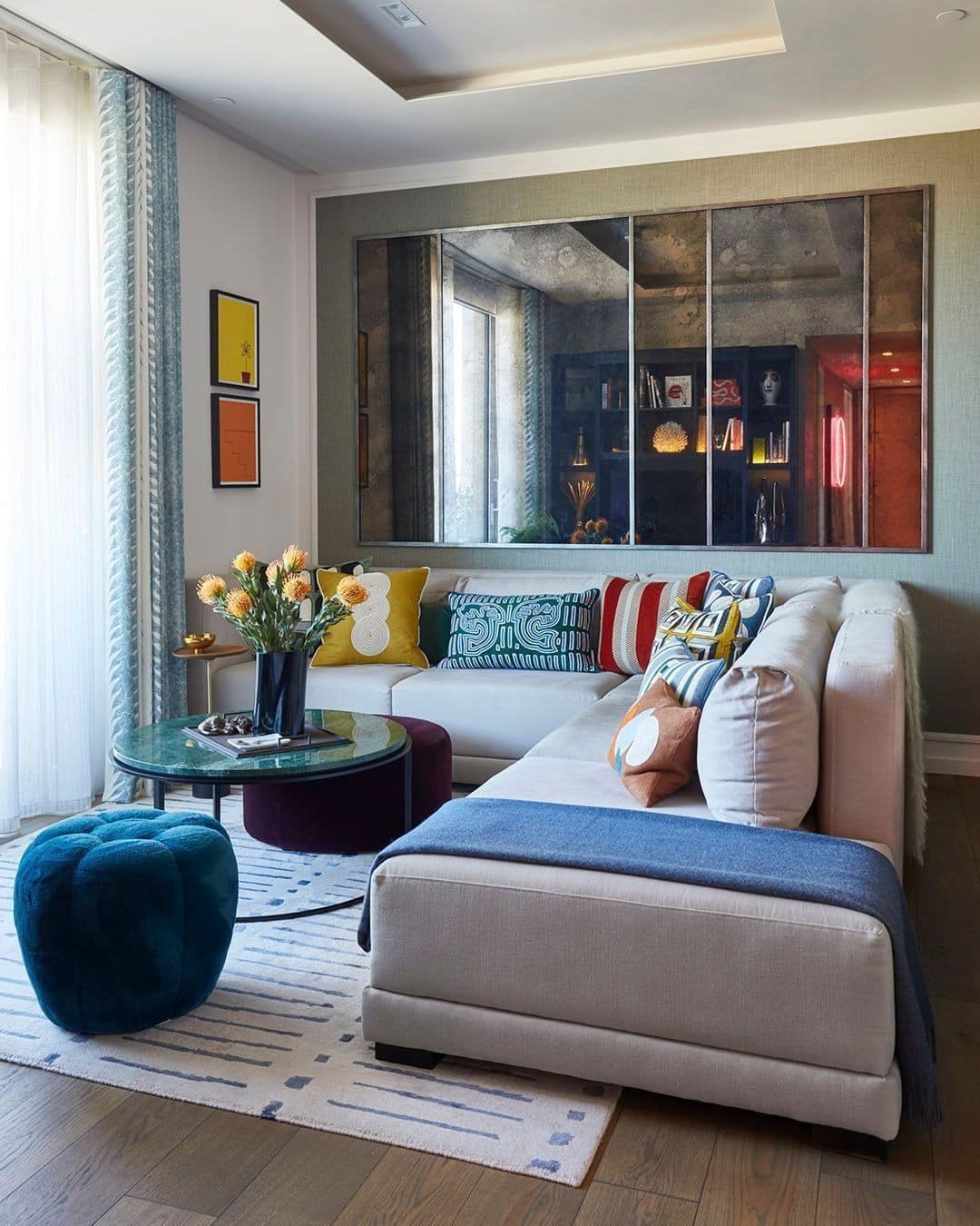 20. Gold Framed Mirror Set in Warm Neutrals and Terracotta - mirrors in living room ideas