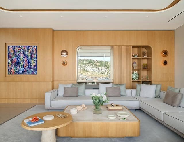 21. Window-Style Mirror Accent in Soft Beige and Black - mirrors in living room ideas