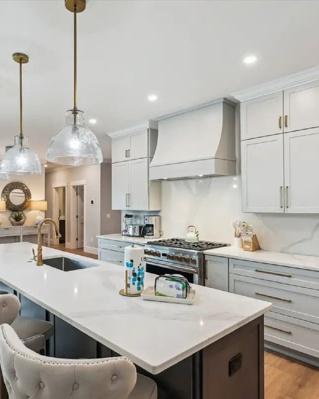4. Crisp Light Gray with Gold Hardware - light gray kitchen ideas
