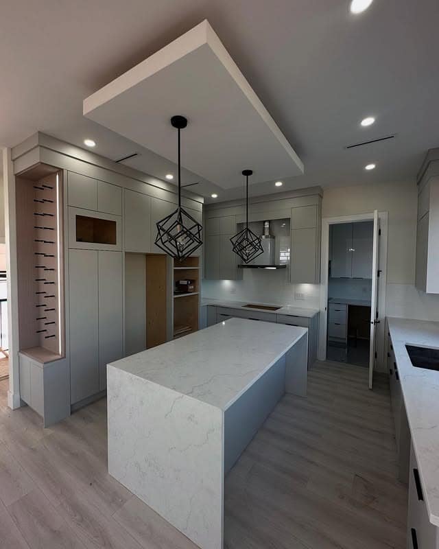 5. Minimalist Gray with Geometric Lighting - light gray kitchen ideas