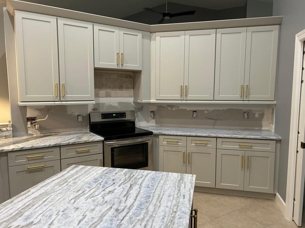 6. Gray Cabinets with Blue-Gray Veined Countertops - light gray kitchen ideas