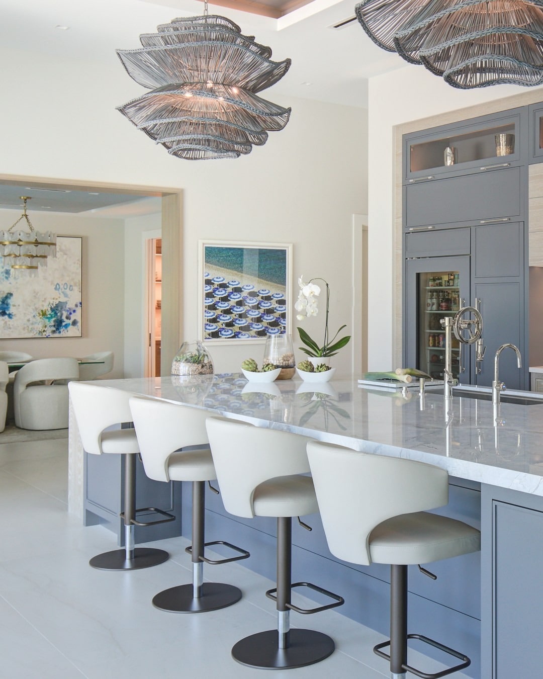 8. Gray Island with Marble Countertop and Sculptural Seating - light gray kitchen ideas