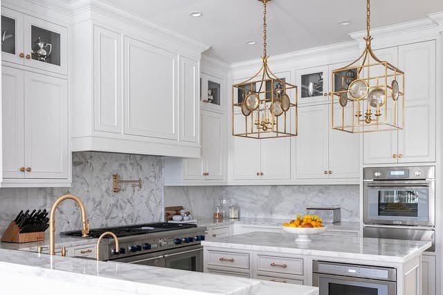 13. Marble-Trimmed Light Gray Kitchen with Brass Accents - light gray kitchen ideas