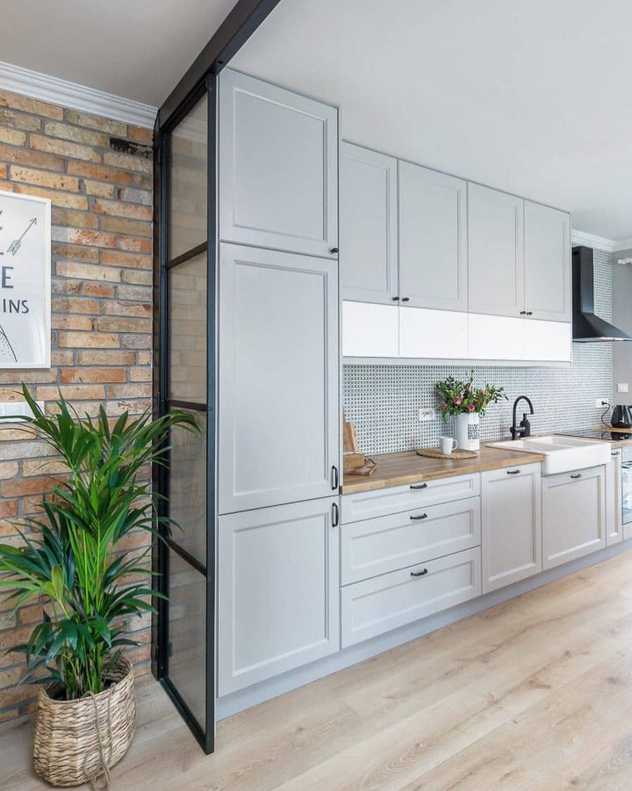 21. Light Gray Shaker Cabinets with Warm Wood Accents - light gray kitchen ideas