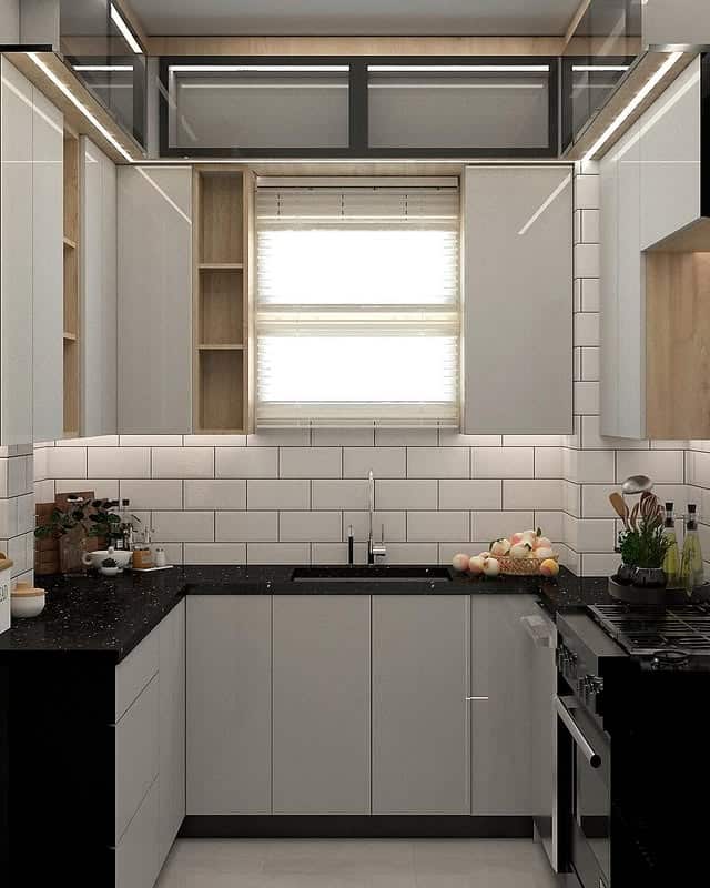 22. Compact Light Gray U-Shaped Kitchen with Black Quartz Counters - light gray kitchen ideas