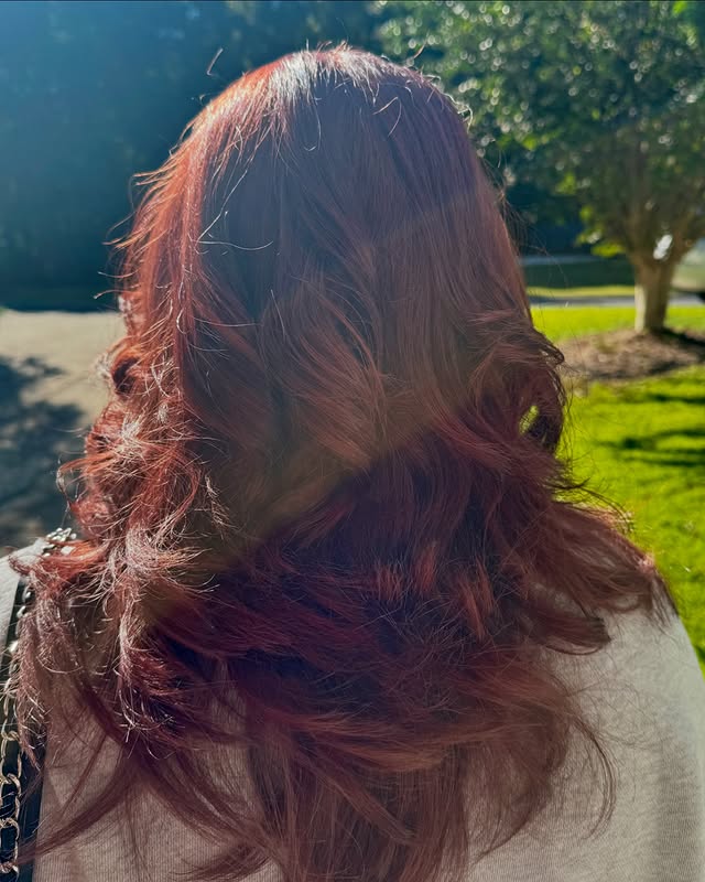 2. Sunlit Mahogany Waves with Dimensional Shine - Mahogany Hair Color