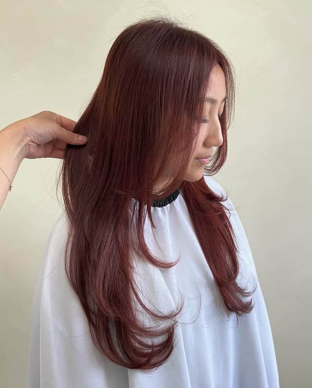 21. Soft Layered Mahogany with Feathered Face Framing - Mahogany Hair Color