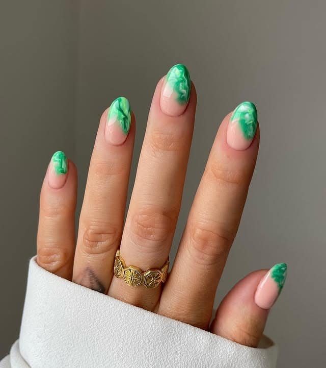 6. Soft Green Marble Tips – Almond Nails - forest green nail ideas