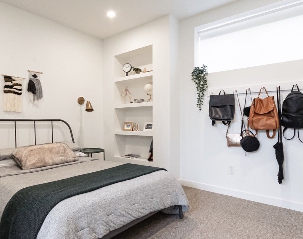 3. Minimal Modern Basement with Built-In Storage - basement bedroom ideas