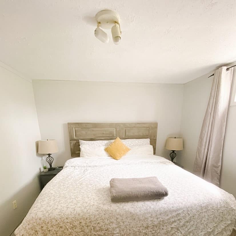 4. Bright Simplicity with Soft Patterned Bedding - basement bedroom ideas