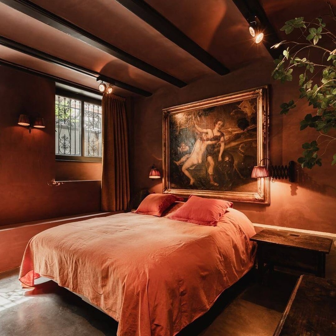 7. Old-World Drama with Terracotta and Moody Lighting - basement bedroom ideas