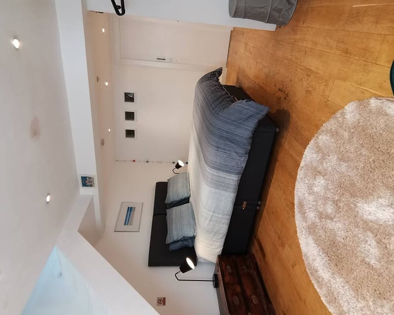 12. Soft Blue Stripes with Clean Modern Lines - basement bedroom ideas