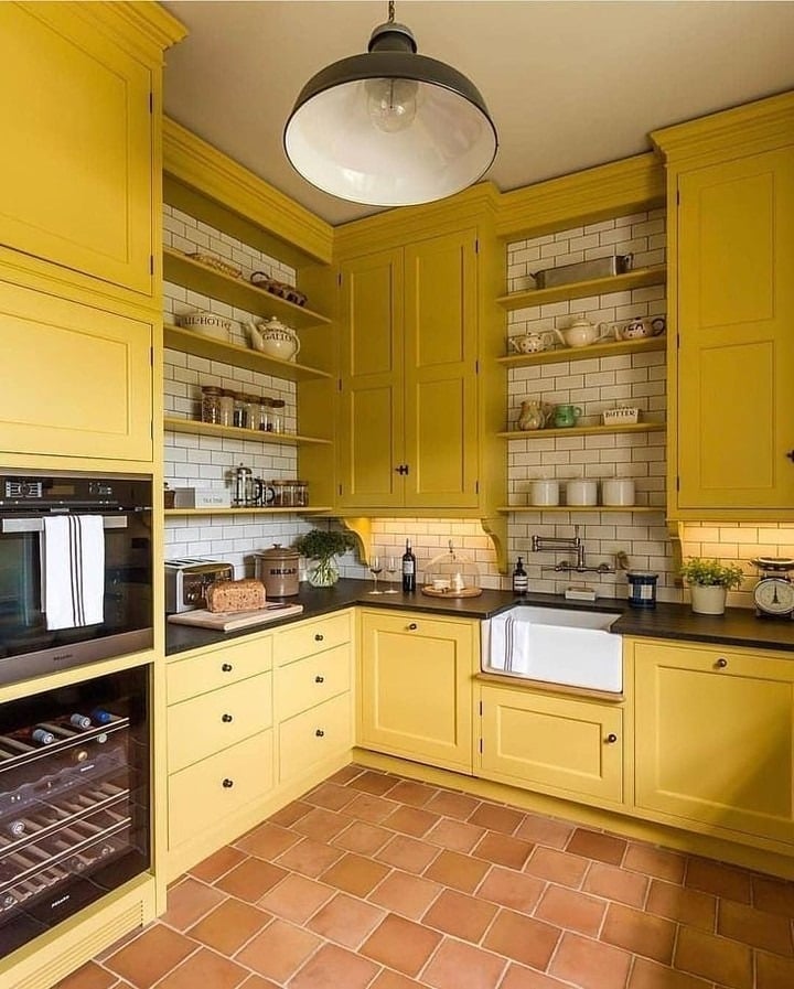 1. Classic Country Yellow Kitchen With Warm Terracotta Grounding - yellow kitchen ideas