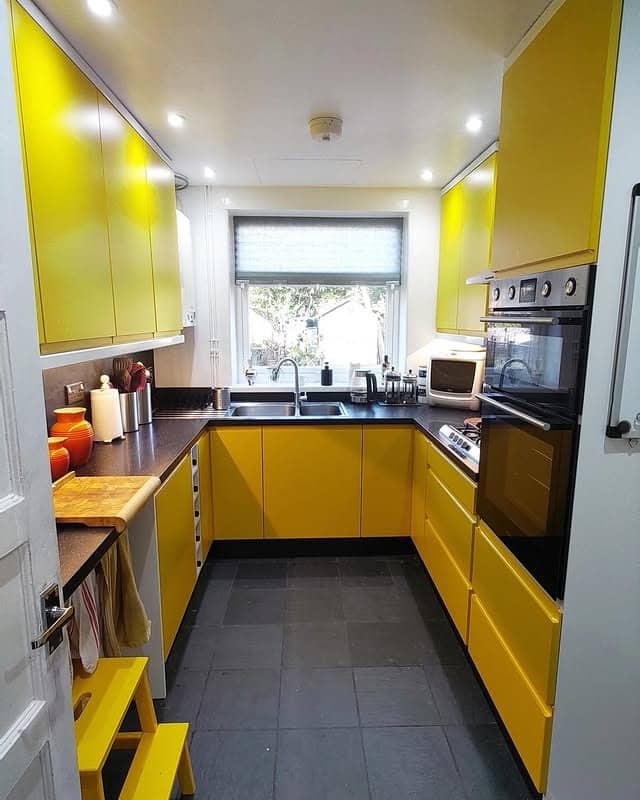 4. Contemporary Compact Yellow Kitchen With Clean Lines - yellow kitchen ideas