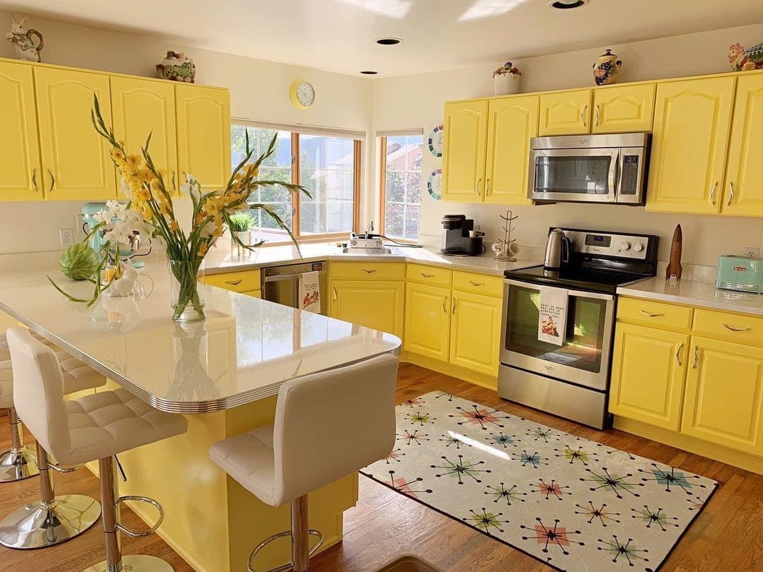 5. Soft Pastel Yellow Kitchen With Retro-Inspired Charm - yellow kitchen ideas