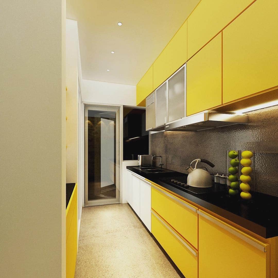 13. Streamlined Yellow Galley Kitchen With Black Accents - yellow kitchen ideas