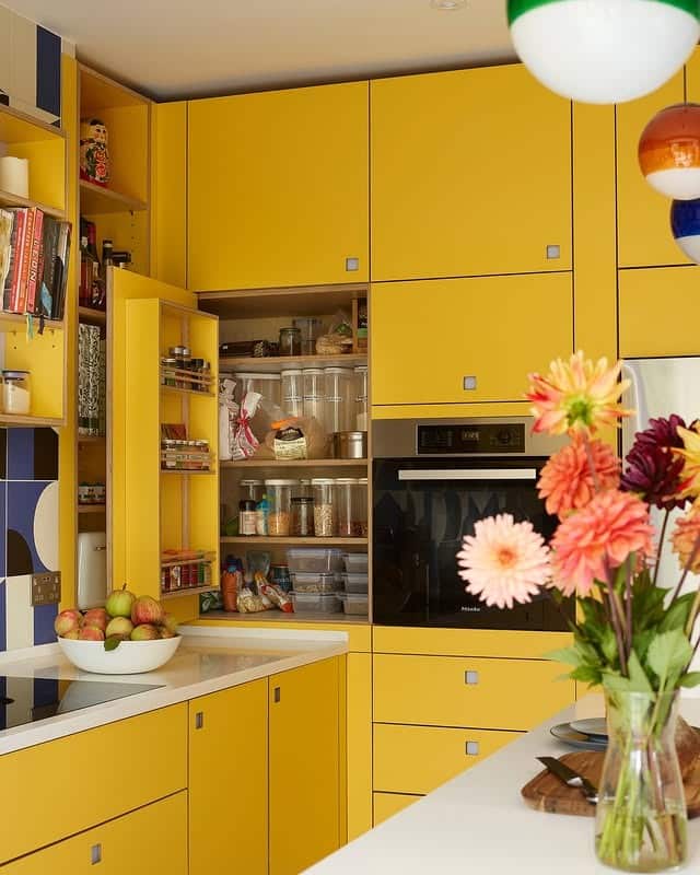 16. Contemporary Yellow Pantry Kitchen With Hidden Storage - yellow kitchen ideas