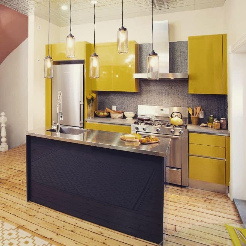 20. Modern Yellow and Steel Kitchen With Industrial Lighting - yellow kitchen ideas