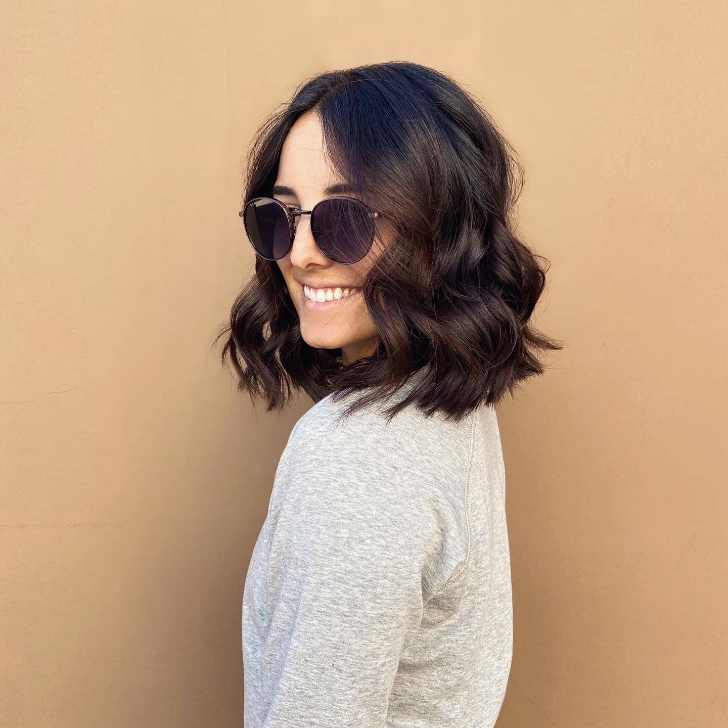 11. Deep Brunette Wavy Lob With Middle Part - Lob Hairstyles