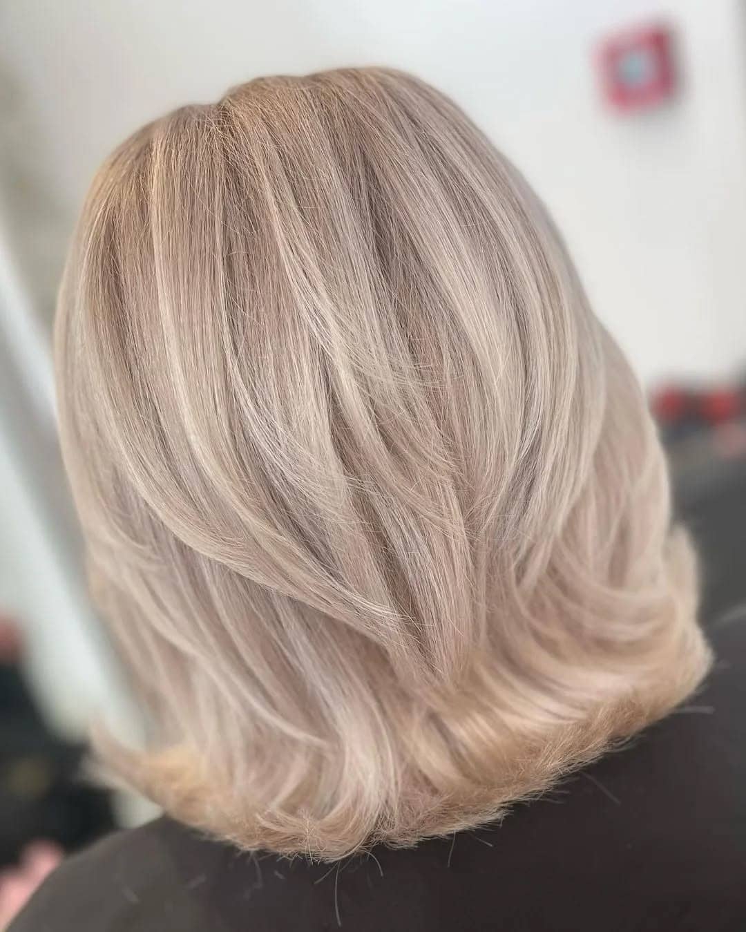 13. Silky Beige Blonde Feathered Midi Cut - Short Layered Haircuts