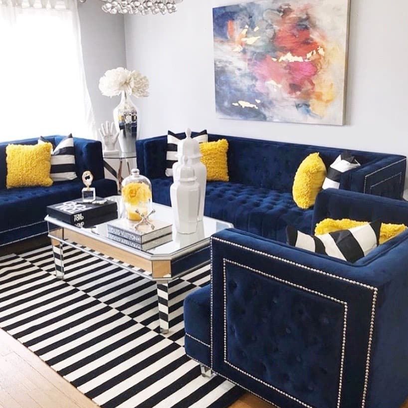 10. Glam Navy Velvet Lounge with Bold Pattern Play - royal blue living room ideas