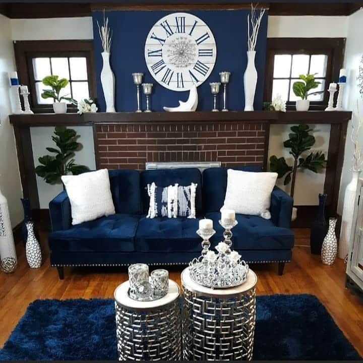 13. Classic Fireplace Setting with Royal Blue and Rich Woodwork - royal blue living room ideas