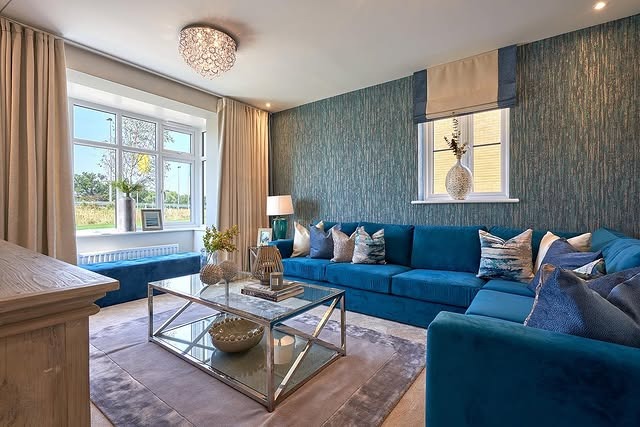 14. Aqua-Infused Royal Blue Sectional with Textured Feature Wall - royal blue living room ideas