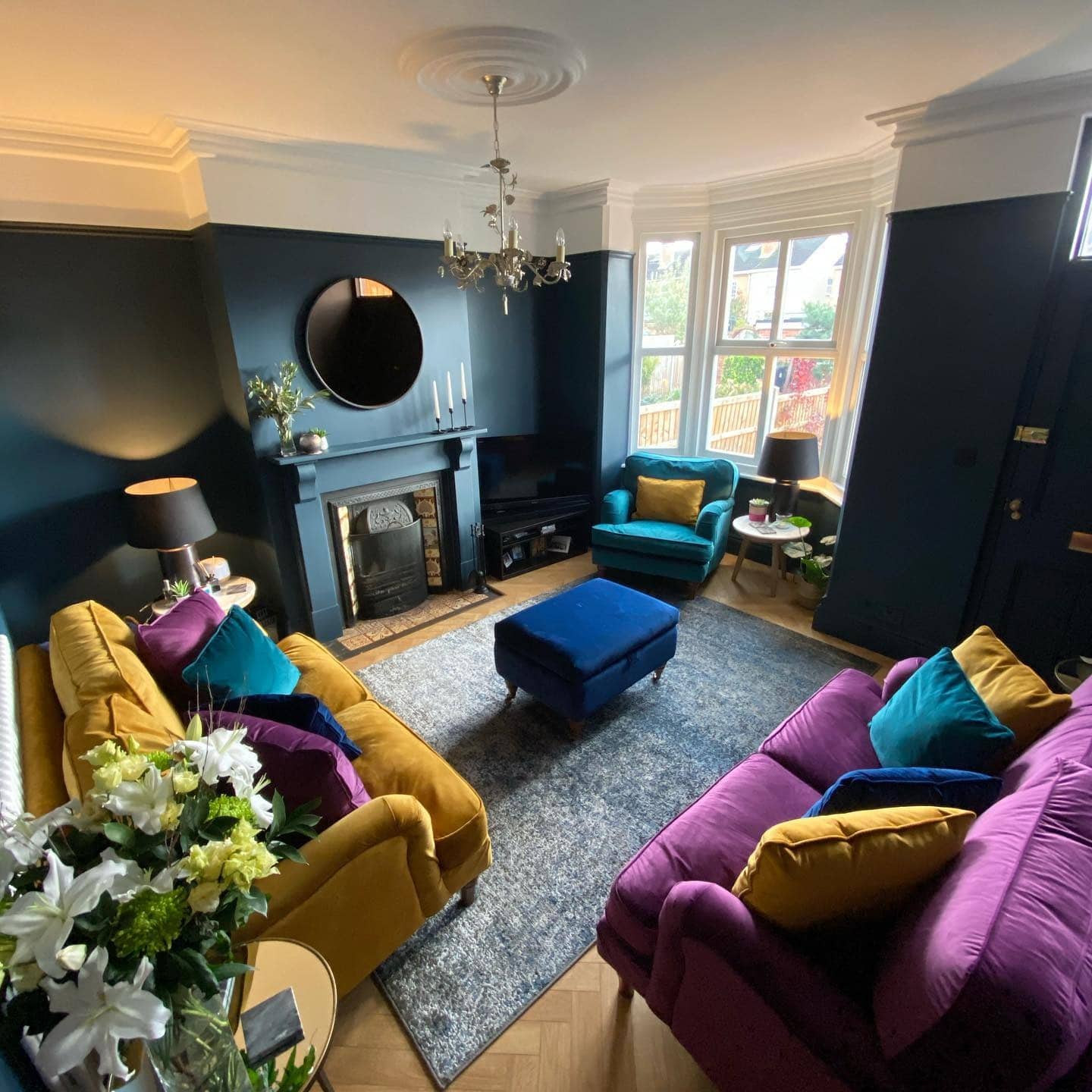 20. Eclectic Royal Blue Living Room with Jewel-Tone Pairings - royal blue living room ideas