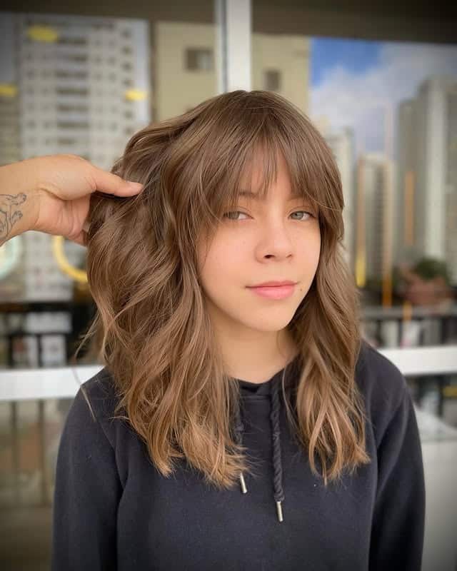 18. Warm Beige Shag with Loose Waves and Curtain Bangs - Shaggy Haircut