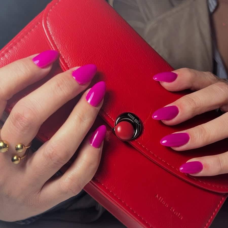 2. Vibrant Fuchsia Almond Nails with High Shine - fuchsia nail ideas