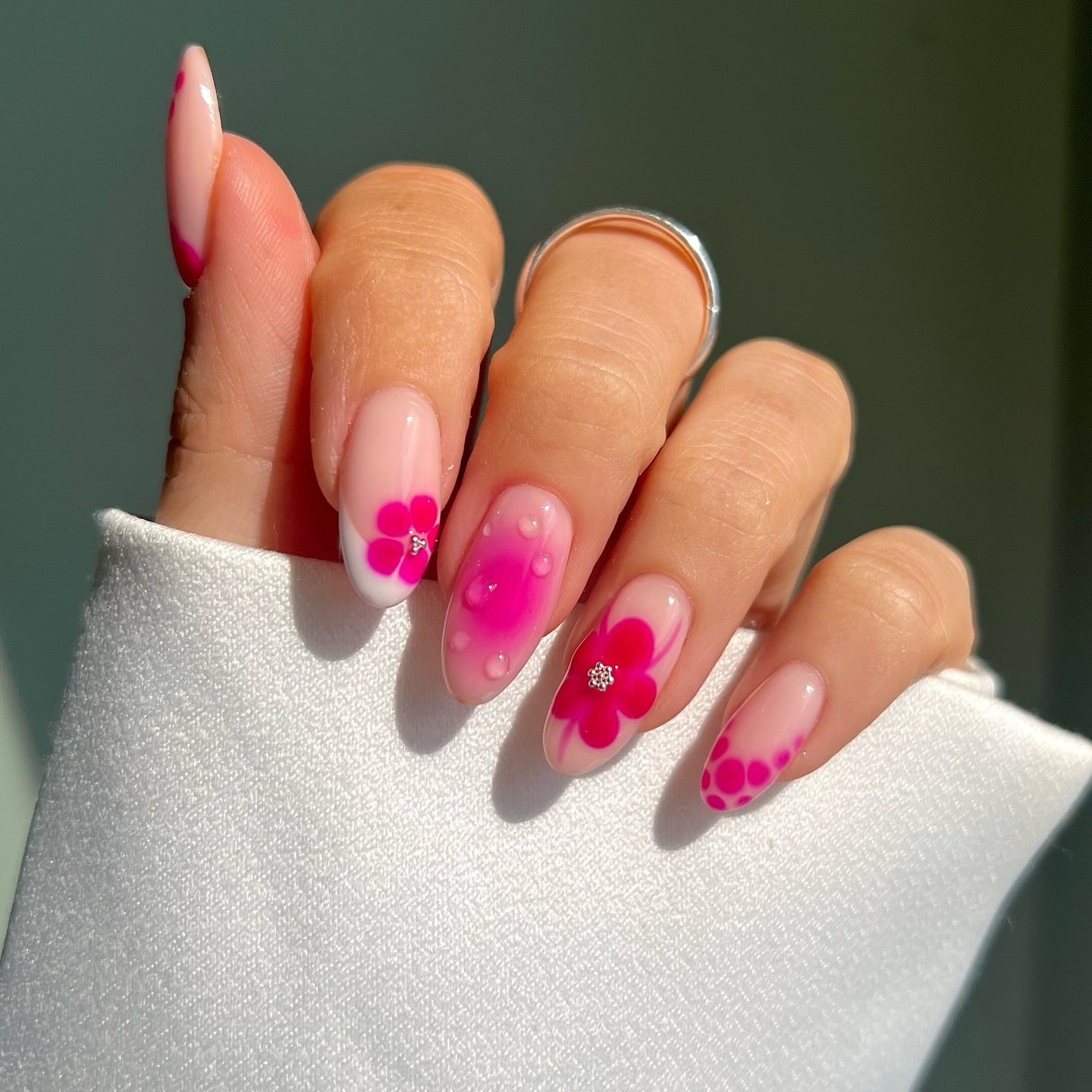 9. Fuchsia Floral Gel Nails with Layered Petal Accents - fuchsia nail ideas